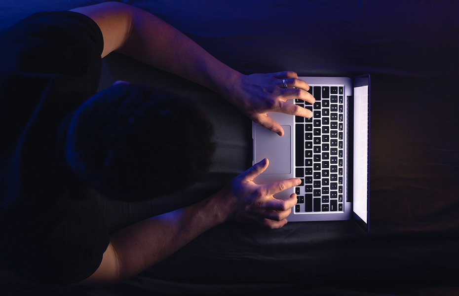 businessman-freelancer-working-overtime-with-laptop-lying-late-night